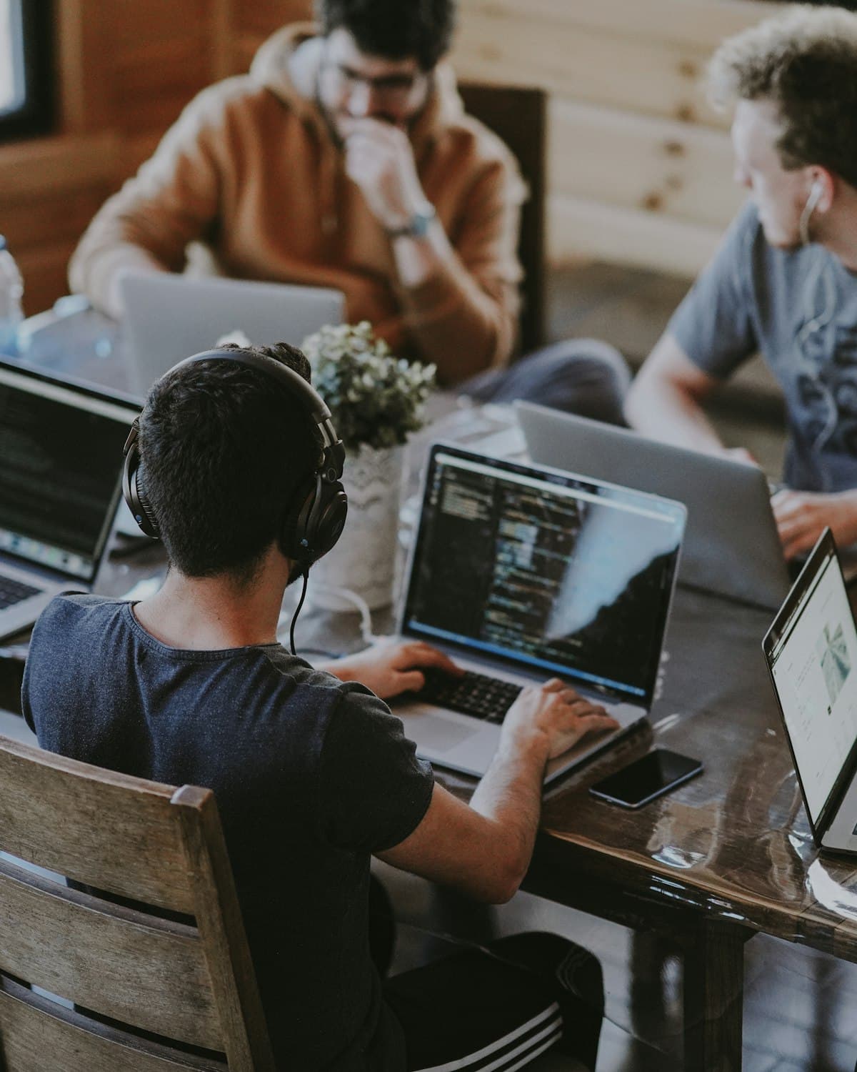 Developers working around a large table